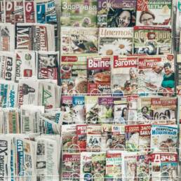 assorted-title magazines displayed on stand